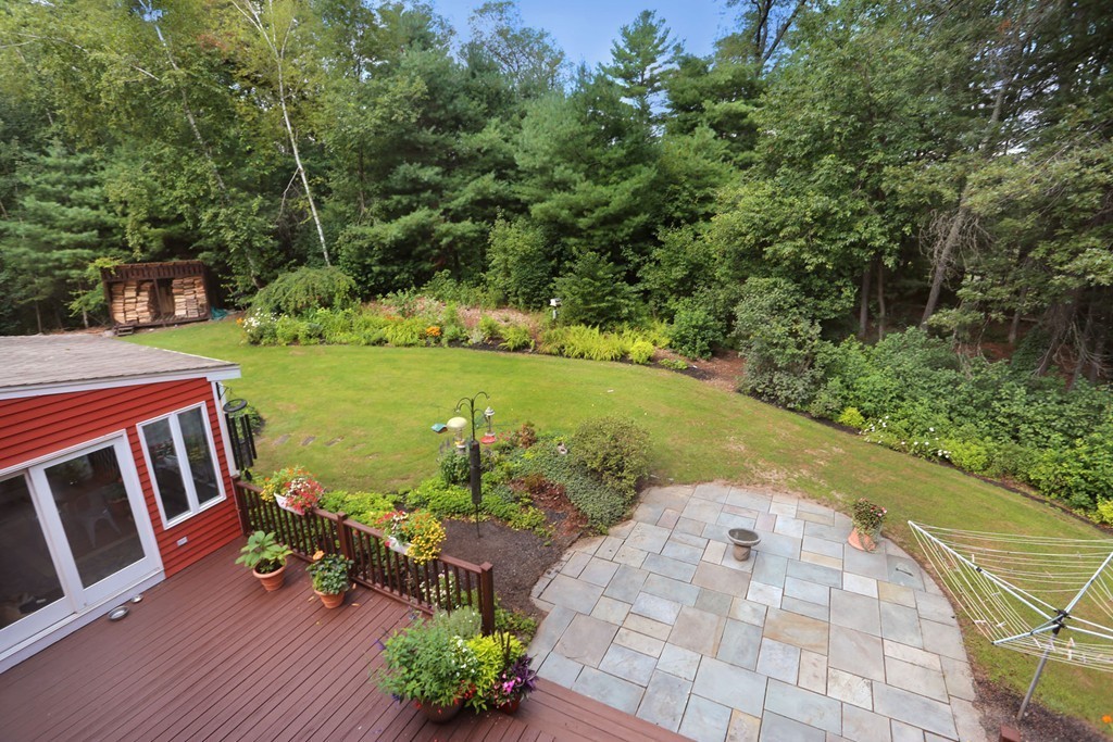 56 Rowley Road Boxford, MA 01921 - Photo 29 of 30 a view of a garden with lawn chairs