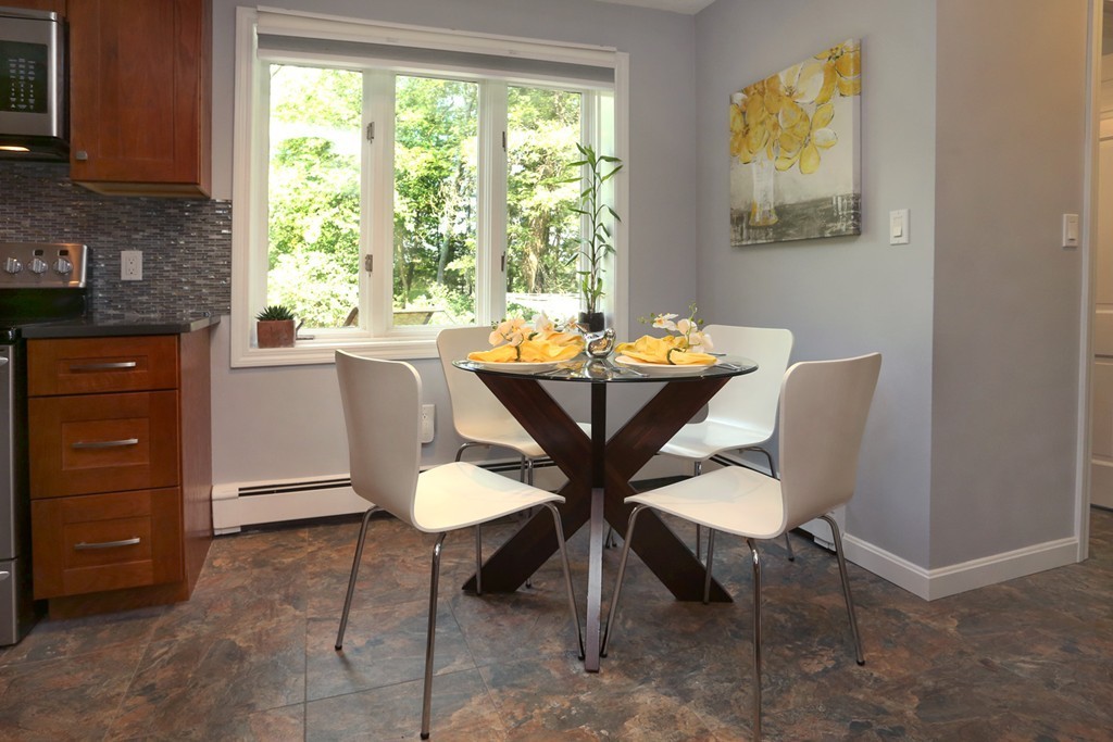 56 Rowley Road Boxford, MA 01921 - Photo 8 of 30 a view of a dining room with furniture and window