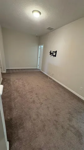 an empty room with a empty space and windows