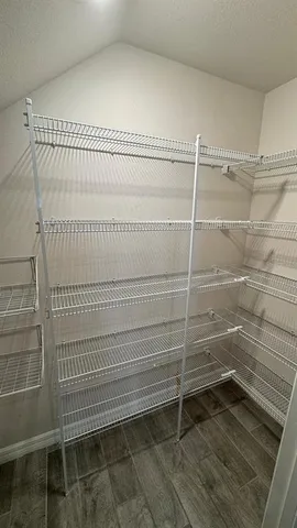 a view of a room with racks on the wall