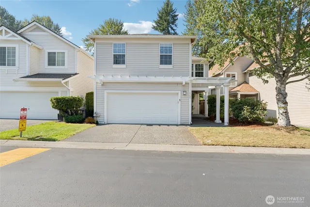 a house that has a tree in front of it