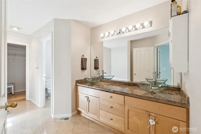 a bathroom with a bathtub and a toilet