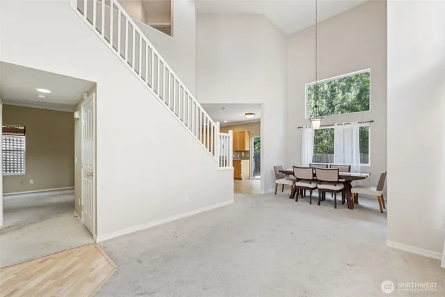 a view of dining room with furniture windows and wooden floor