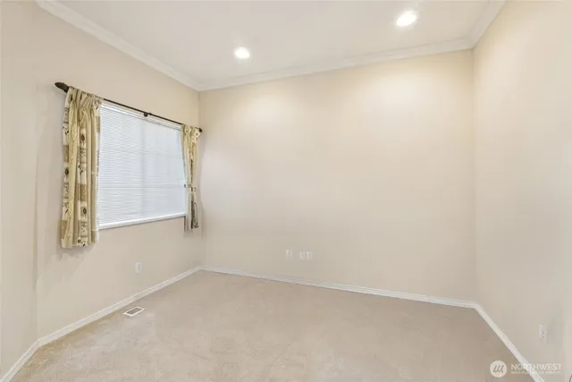 a bedroom with a bed and a table