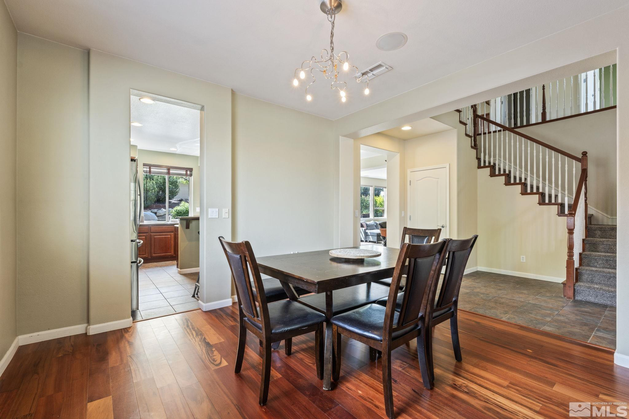 10890 Sand Hollow Court Reno, NV 89521 - Photo 18 of 40 a view of a dining room with furniture and wooden floor