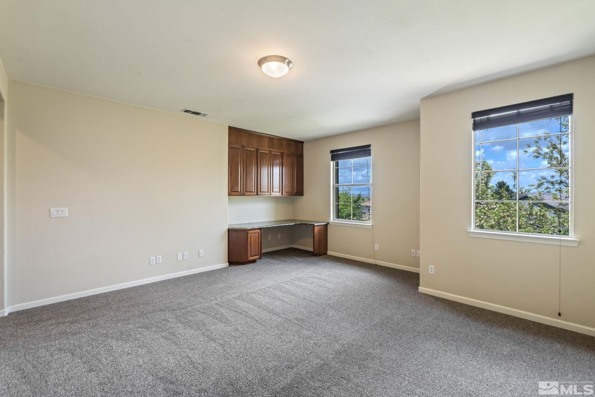10890 Sand Hollow Court Reno, NV 89521 - Photo 21 of 40 a view of an empty room with a window