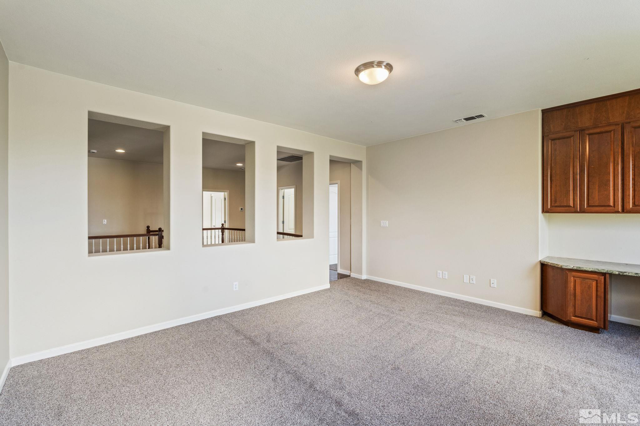 10890 Sand Hollow Court Reno, NV 89521 - Photo 22 of 40 an empty room with windows