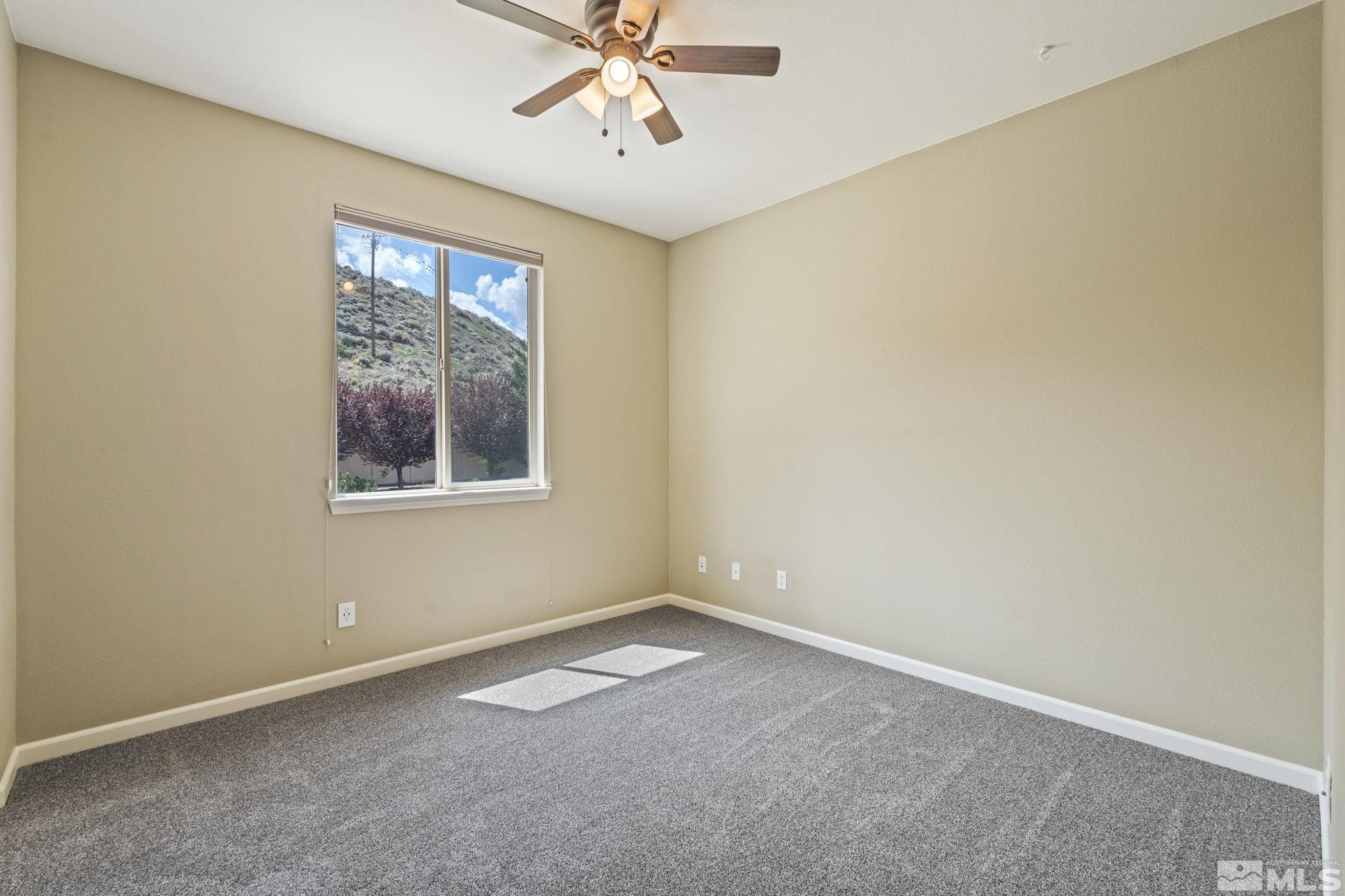 10890 Sand Hollow Court Reno, NV 89521 - Photo 26 of 40 an empty room with a window