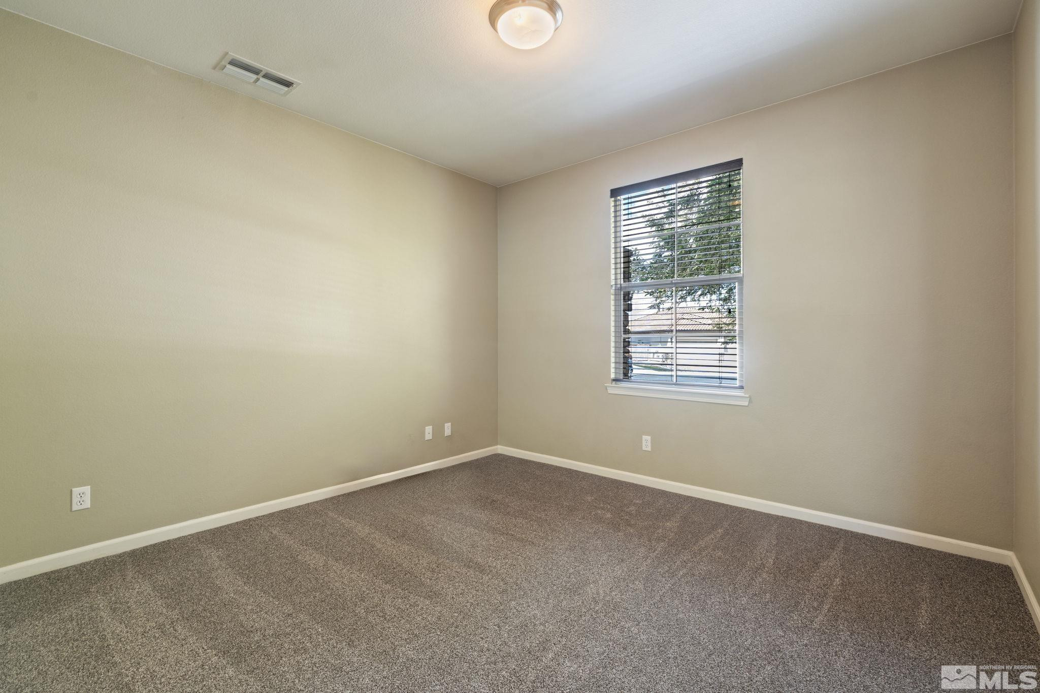 10890 Sand Hollow Court Reno, NV 89521 - Photo 27 of 40 an empty room with windows