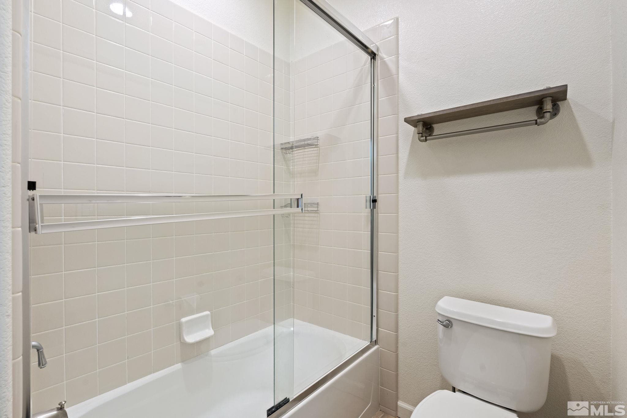 10890 Sand Hollow Court Reno, NV 89521 - Photo 29 of 40 a bathroom with a shower and a toilet