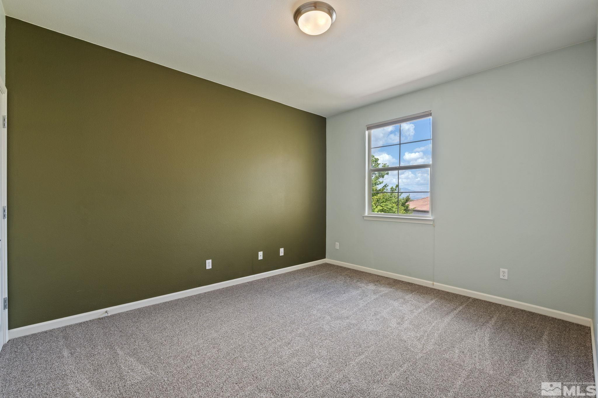 10890 Sand Hollow Court Reno, NV 89521 - Photo 30 of 40 an empty room with windows