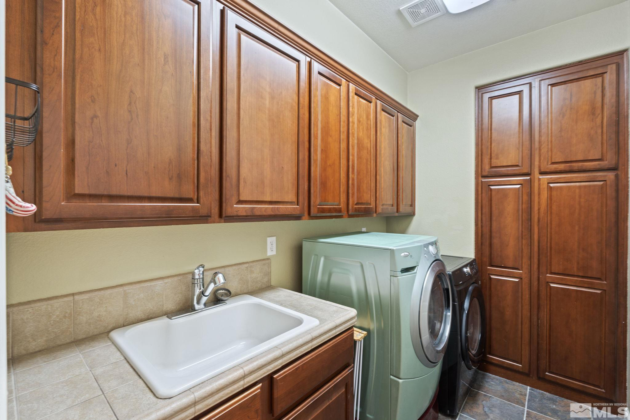 10890 Sand Hollow Court Reno, NV 89521 - Photo 32 of 40 a utility room with dryer and washer