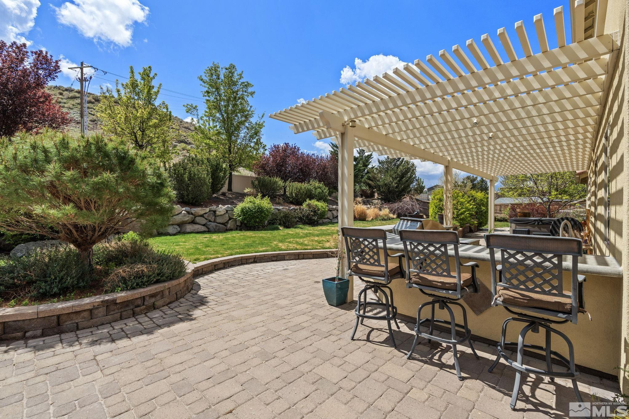 10890 Sand Hollow Court Reno, NV 89521 - Photo 34 of 40 a view of a chairs and tables in the patio