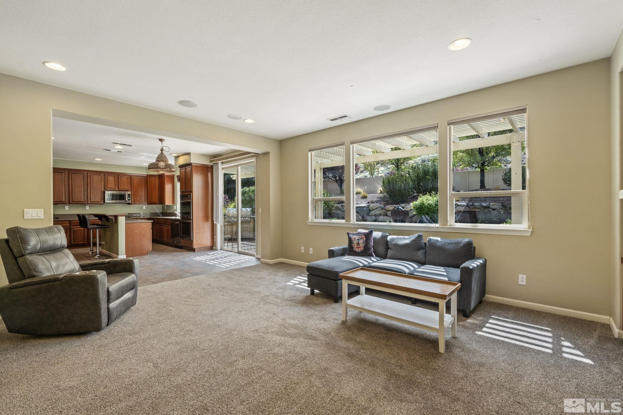 10890 Sand Hollow Court Reno, NV 89521 - Photo 6 of 40 a living room with furniture and a large window