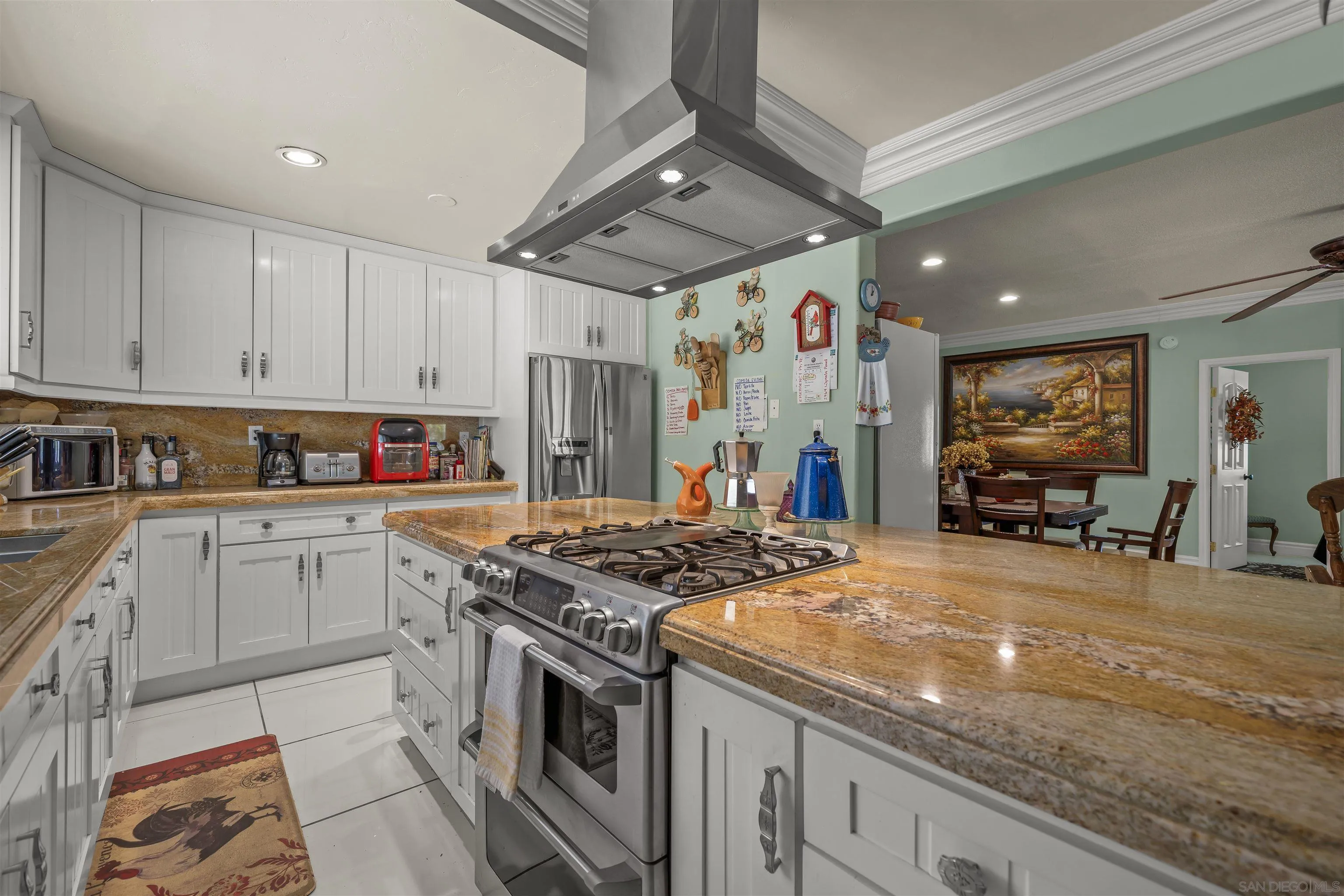 2464 Wynola Road Julian, CA 92036 - Photo 7 of 50 a kitchen with stainless steel appliances granite countertop a stove a sink dishwasher and cabinets with wooden floor