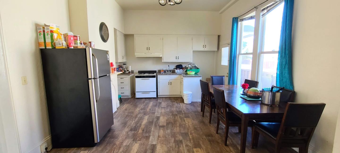503 North 4th Street San Jose, CA 95112 - Photo 11 of 15 a kitchen with stainless steel appliances a refrigerator sink stove dining table and chairs