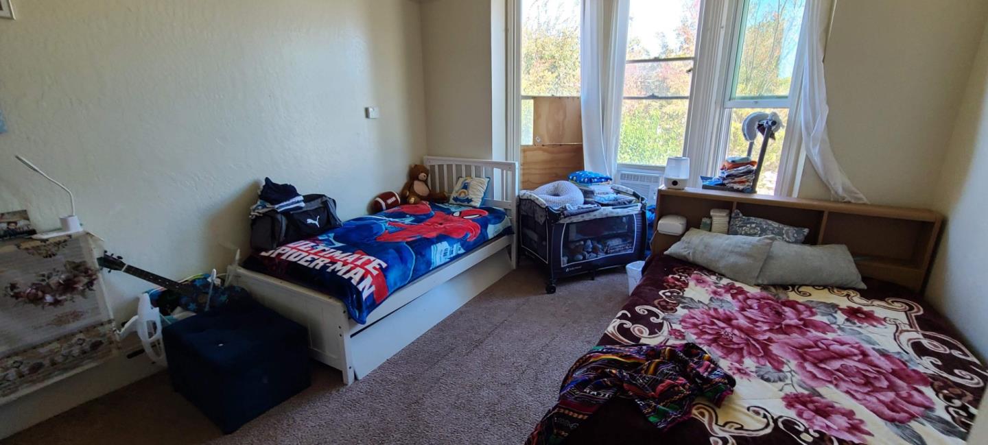503 North 4th Street San Jose, CA 95112 - Photo 14 of 15 a living room with furniture and a floor to ceiling window