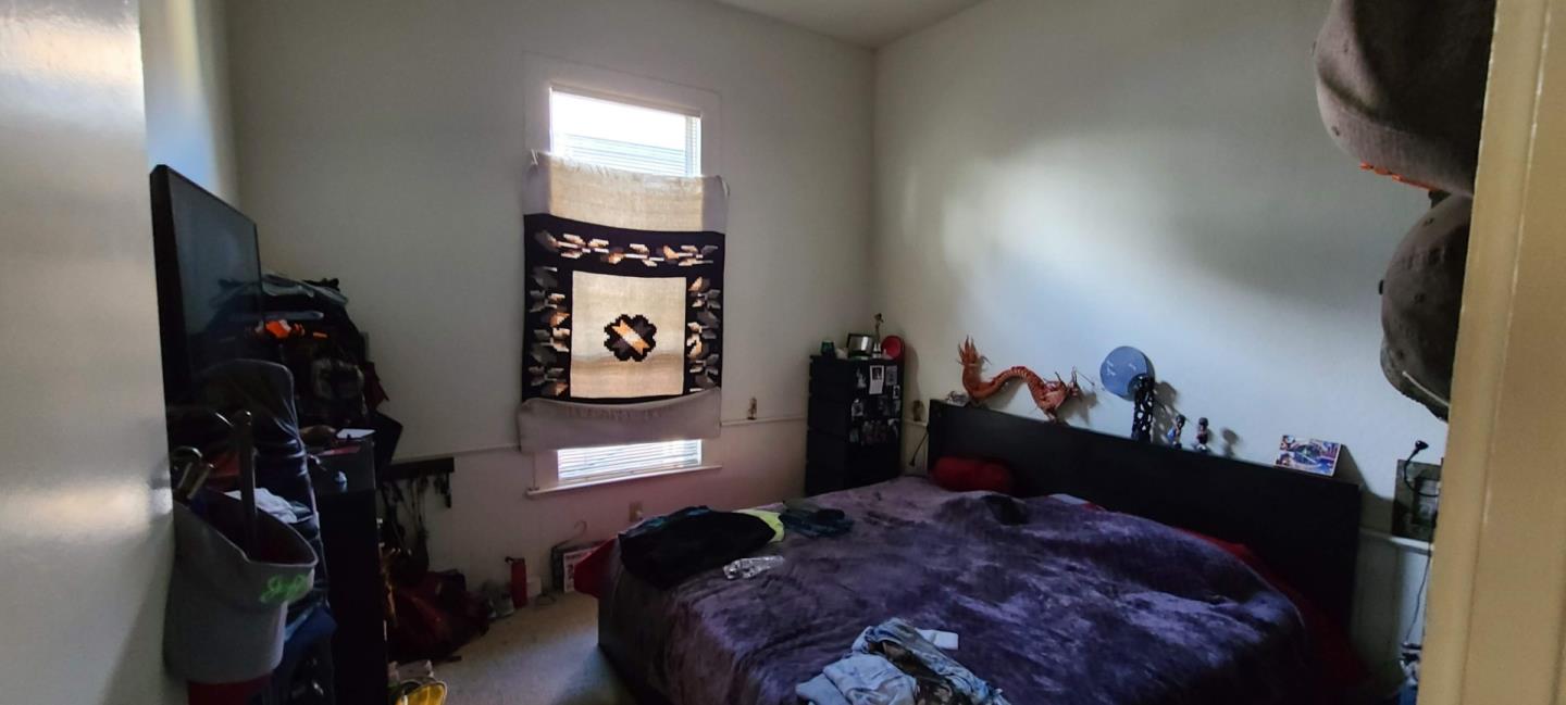 503 North 4th Street San Jose, CA 95112 - Photo 6 of 15 a bed room with a bed and a television