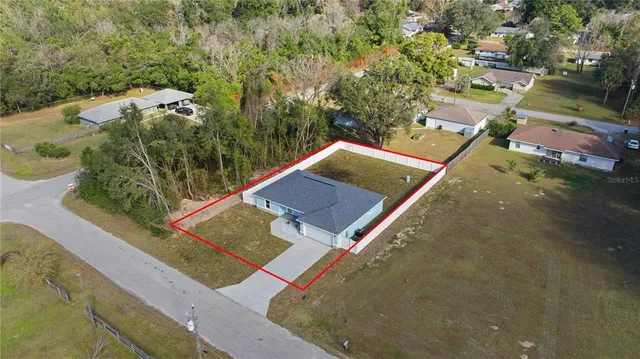 swimming pool view with a garden