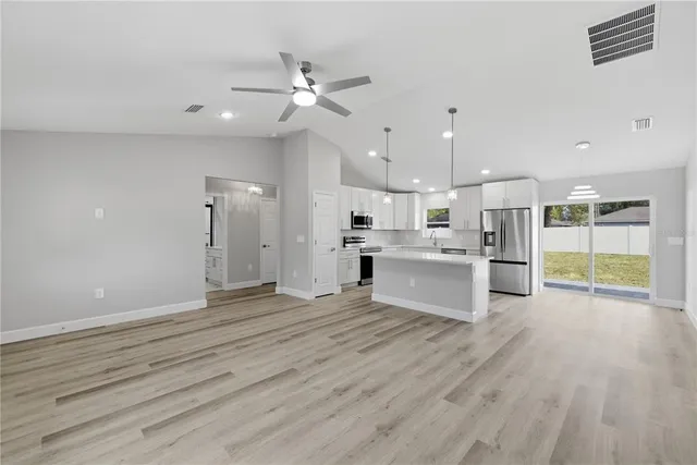 a view of kitchen with wooden floor