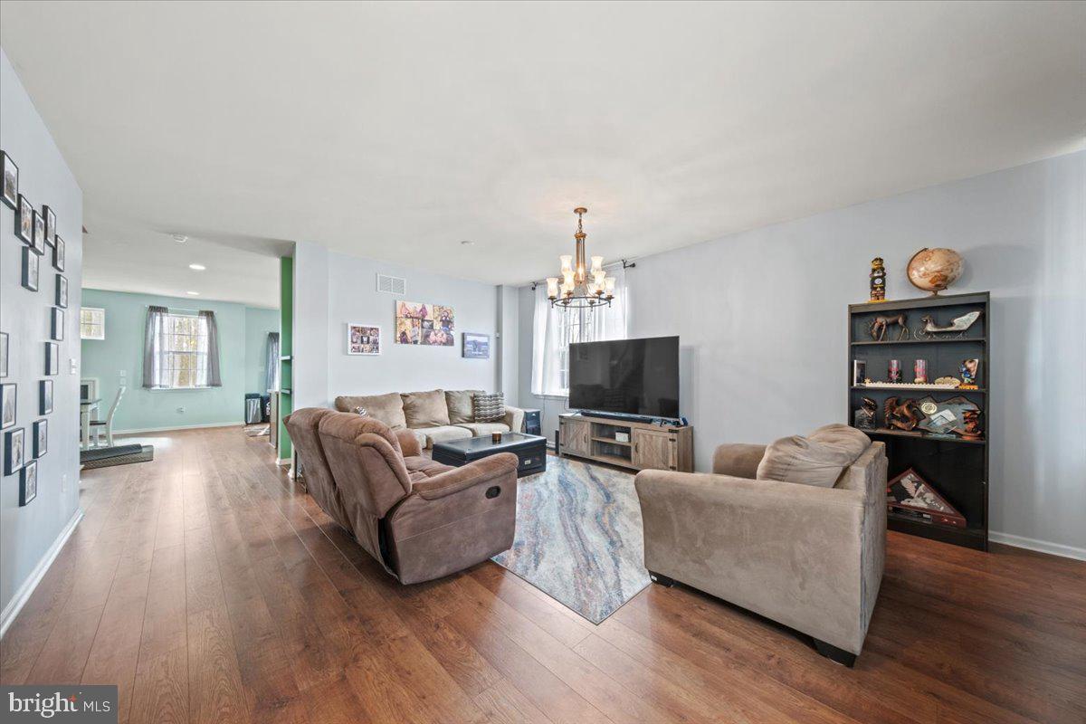 61 Homestead Drive Pemberton, NJ 08068 - Photo 11 of 40 a living room with furniture and a flat screen tv