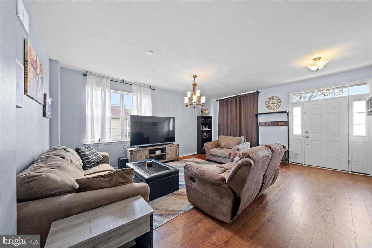 61 Homestead Drive Pemberton, NJ 08068 - Photo 13 of 40 a living room with furniture and a flat screen tv