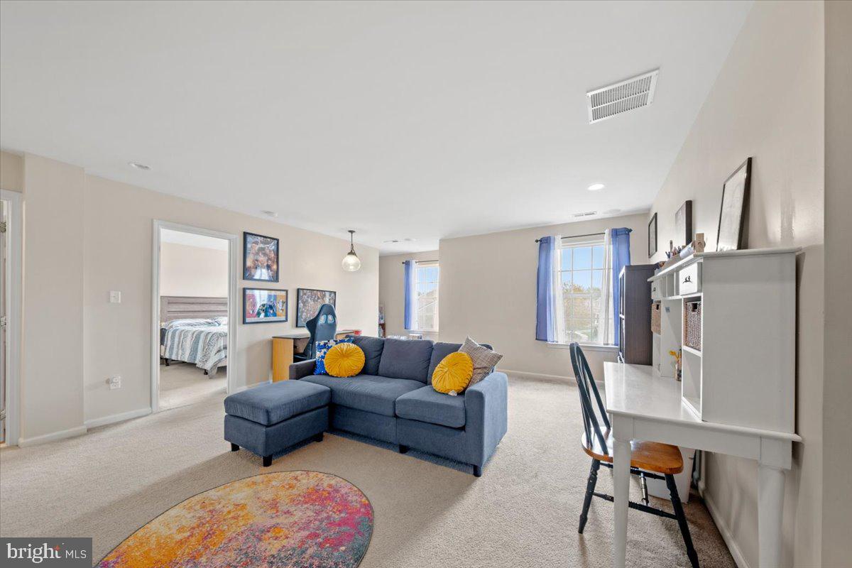 61 Homestead Drive Pemberton, NJ 08068 - Photo 15 of 40 a living room with furniture and a couch