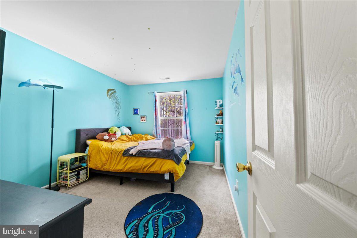 61 Homestead Drive Pemberton, NJ 08068 - Photo 20 of 40 a bedroom with bed and a window