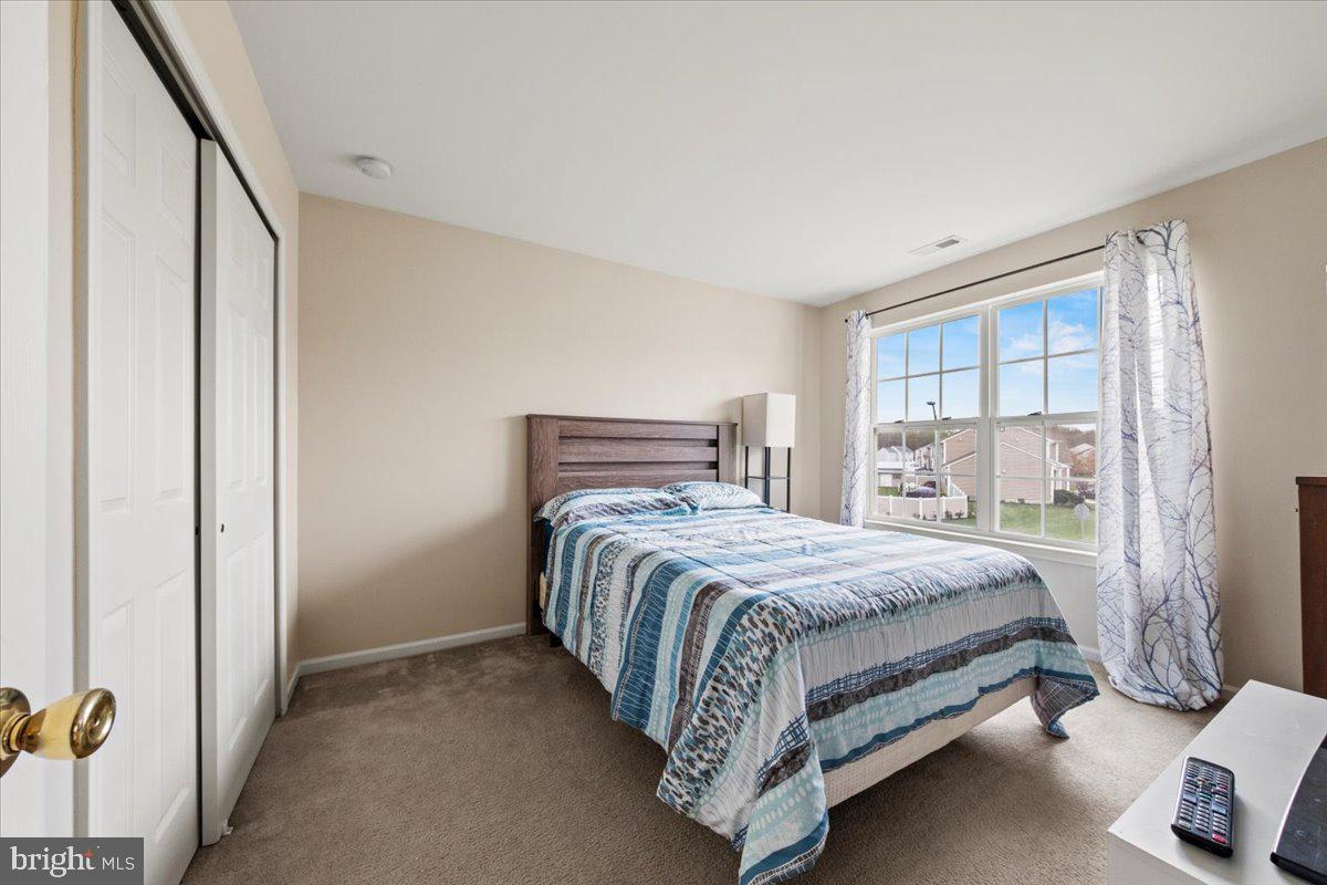 61 Homestead Drive Pemberton, NJ 08068 - Photo 25 of 40 a bedroom with a bed and a window