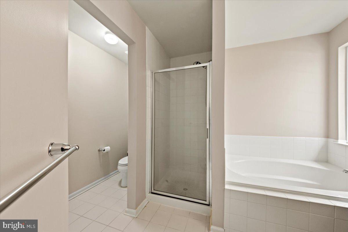 61 Homestead Drive Pemberton, NJ 08068 - Photo 30 of 40 a bathroom with a granite countertop bathtub and toilet
