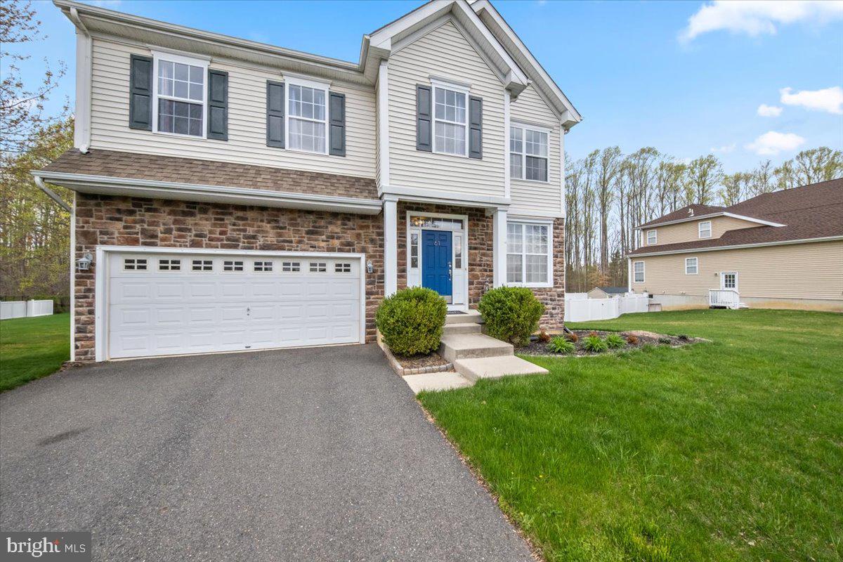 61 Homestead Drive Pemberton, NJ 08068 - Photo 3 of 40 a view of a house with a yard and garage