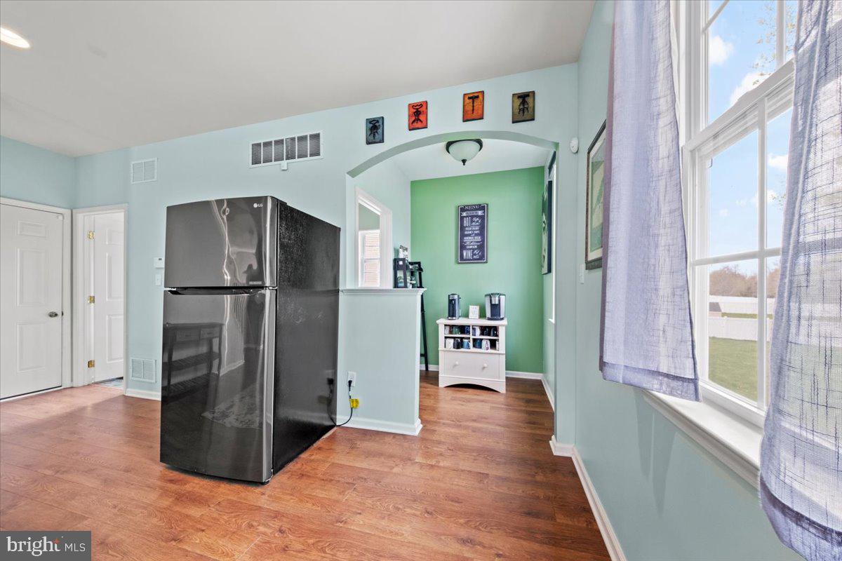 61 Homestead Drive Pemberton, NJ 08068 - Photo 32 of 40 a kitchen with stainless steel appliances a refrigerator and a window