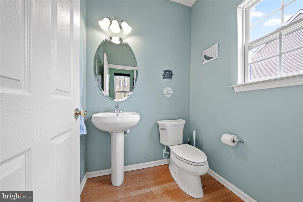 61 Homestead Drive Pemberton, NJ 08068 - Photo 34 of 40 a bathroom with a toilet a sink and a mirror