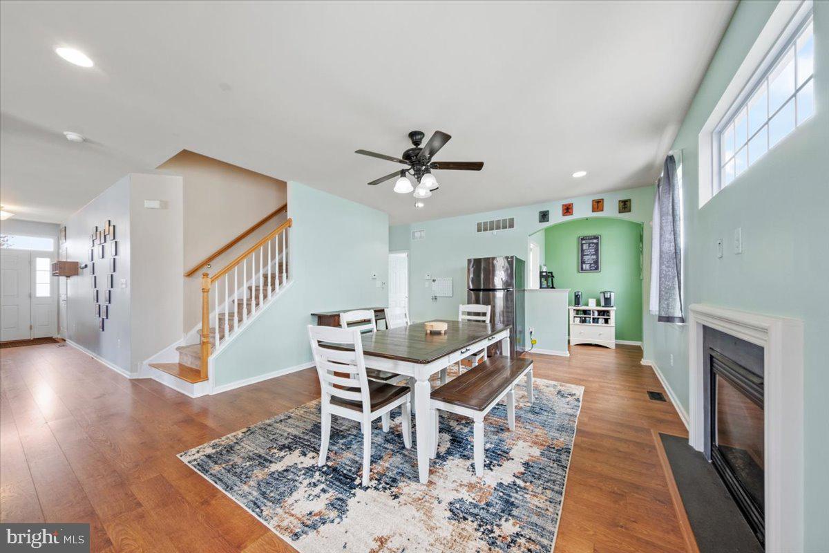 61 Homestead Drive Pemberton, NJ 08068 - Photo 7 of 40 a dining room with furniture a rug and a chandelier