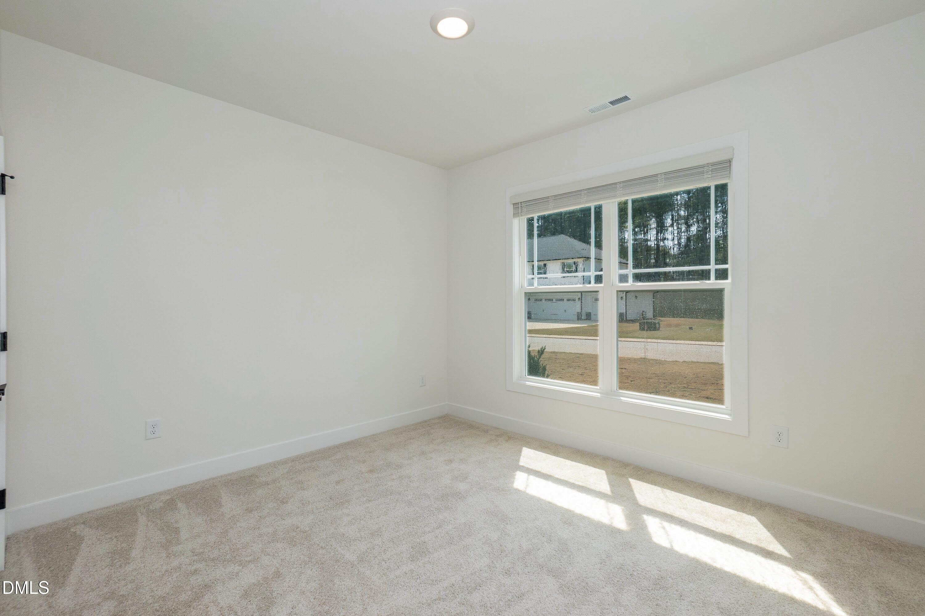 180 Galway Road Lillington, NC 27546 - Photo 28 of 41 an empty room with a window