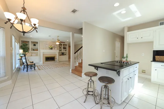 a kitchen with stainless steel appliances granite countertop a stove and a refrigerator