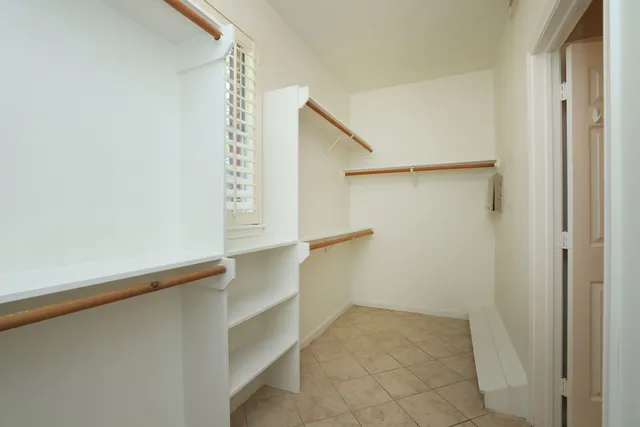 a view of an empty walk in closet
