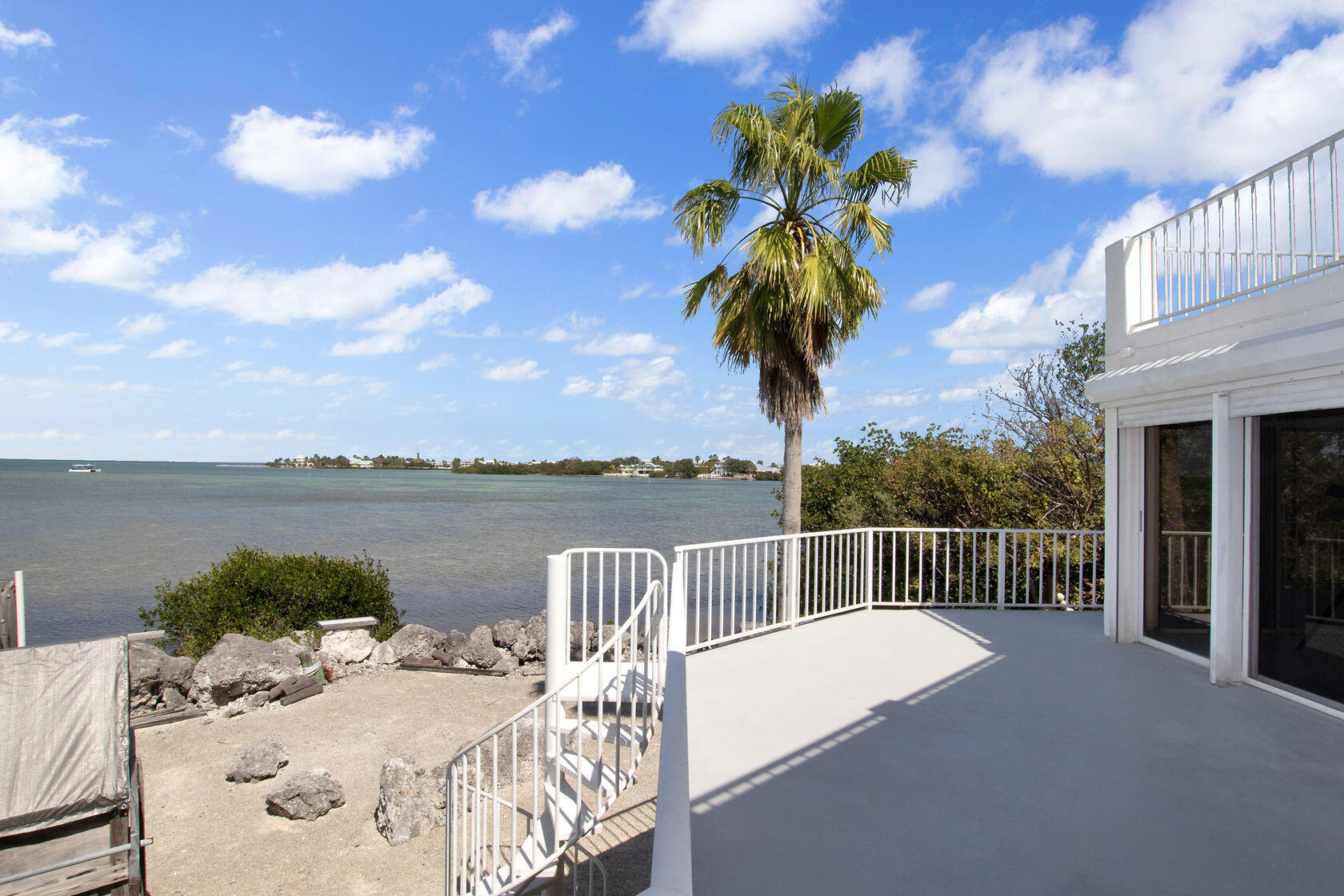 140 Brian Road Marathon, FL 33050 - Photo 24 of 54 a view of a balcony with lake view and a potted plant