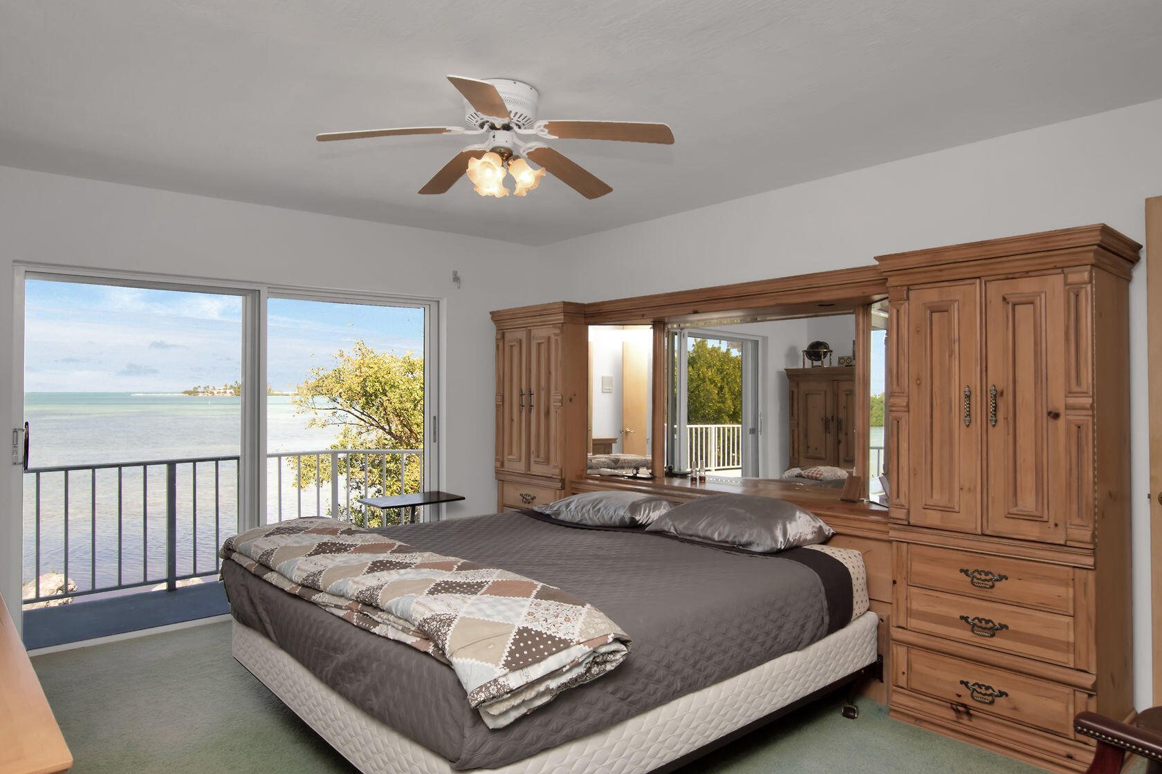 140 Brian Road Marathon, FL 33050 - Photo 33 of 54 a spacious bedroom with a bed and a large window