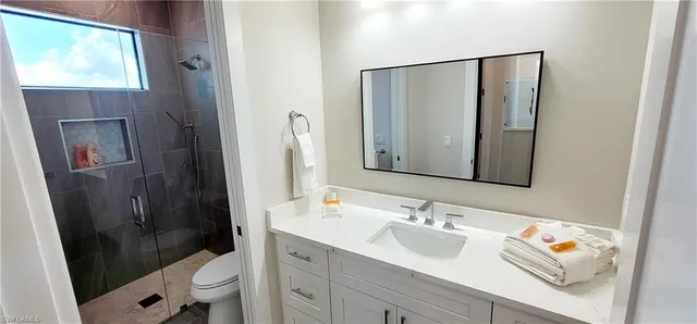 a bedroom with a bed and a lamp