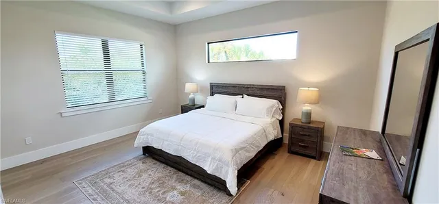 a bathroom with a sink toilet and shower a mirror