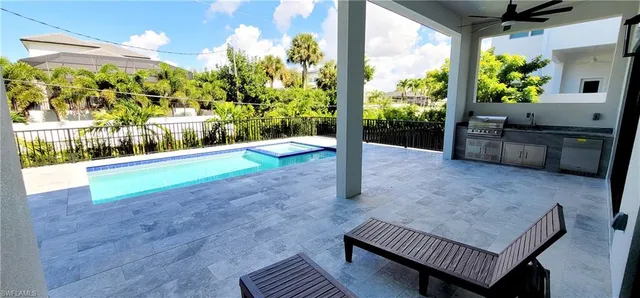 a bathroom with a double vanity sink mirror and toilet