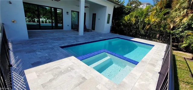 a view of a hallway with wooden floor and a hallway