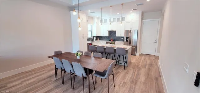 a view of living room with granite countertop furniture and flat screen