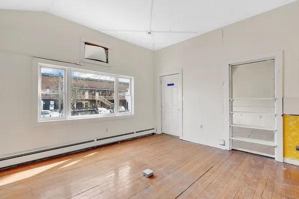 a view of an empty room and fire place