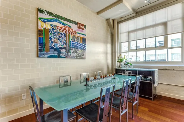 a view of a dining room with furniture window and wooden floor