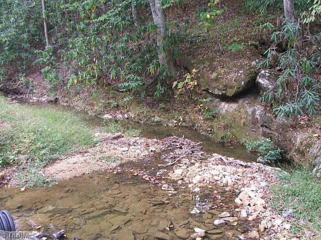 22 Mission Road Danbury, NC 27016 - Photo 10 of 15 Exterior Front. Creek going to common aera