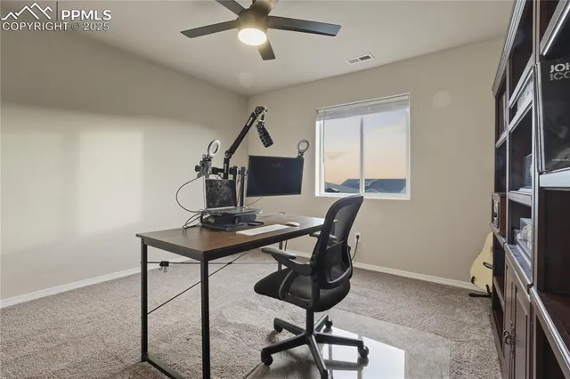 a view of a workspace with furniture