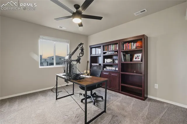a view of a workspace with furniture
