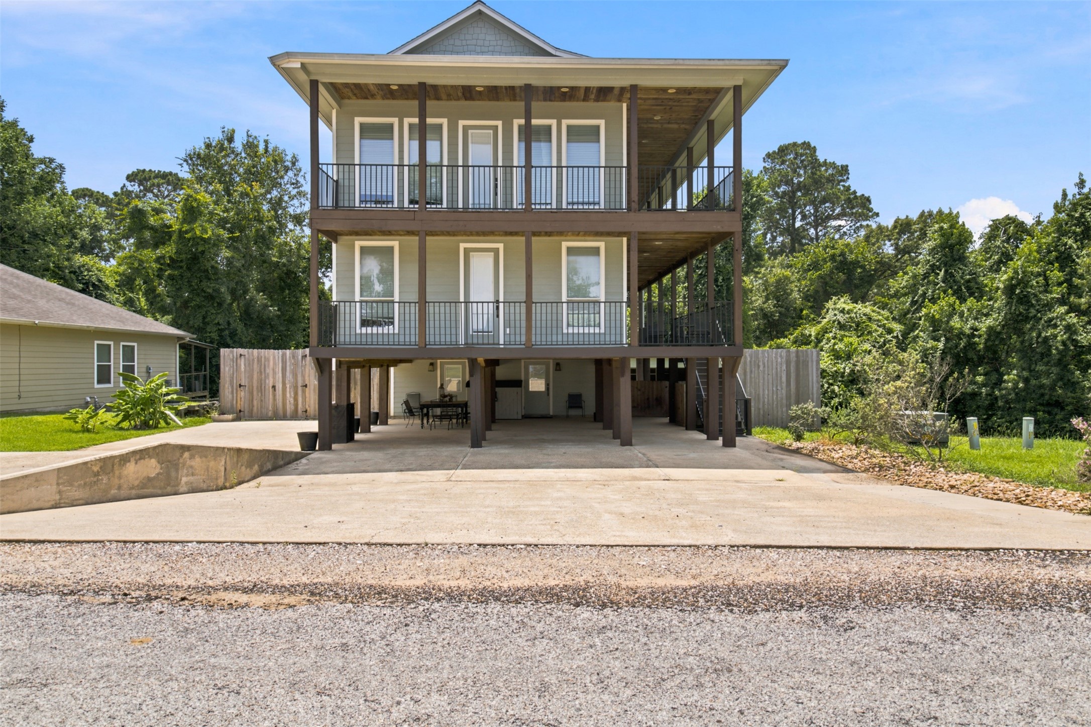 201 Coco Loop Point Blank, TX 77364 - Photo 20 of 41 2 car carport spaces and 1 golf cart space, 1 boat parking space or camper parking space lots of parking to say the least. Let not forget about the lot on the right side of the home.
